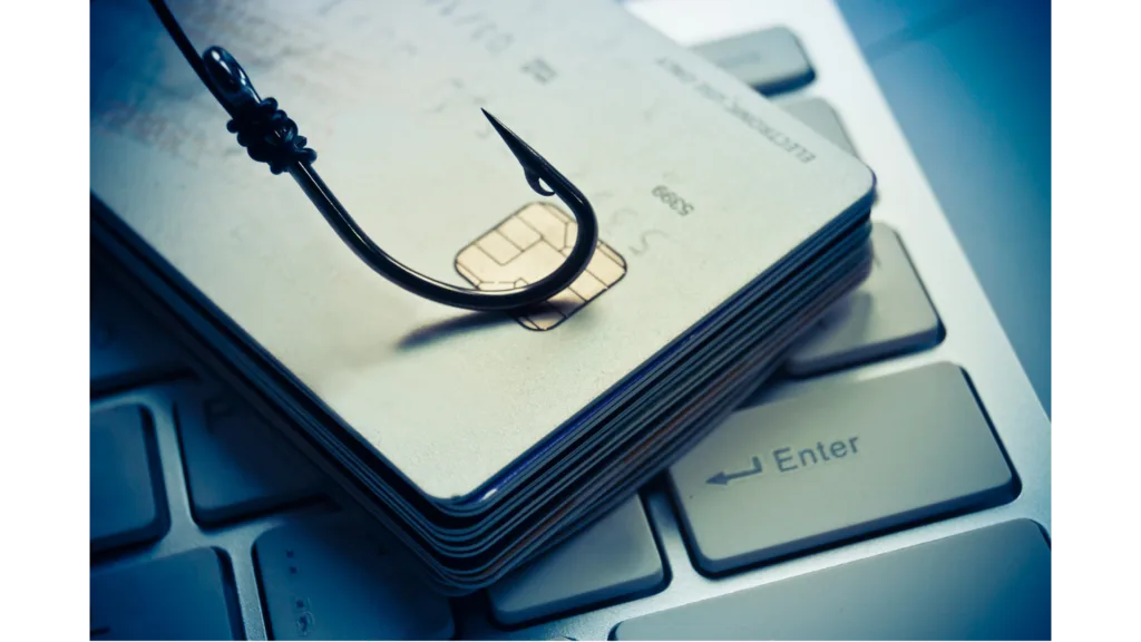 Illustration of a phishing hook resting on a computer keyboard